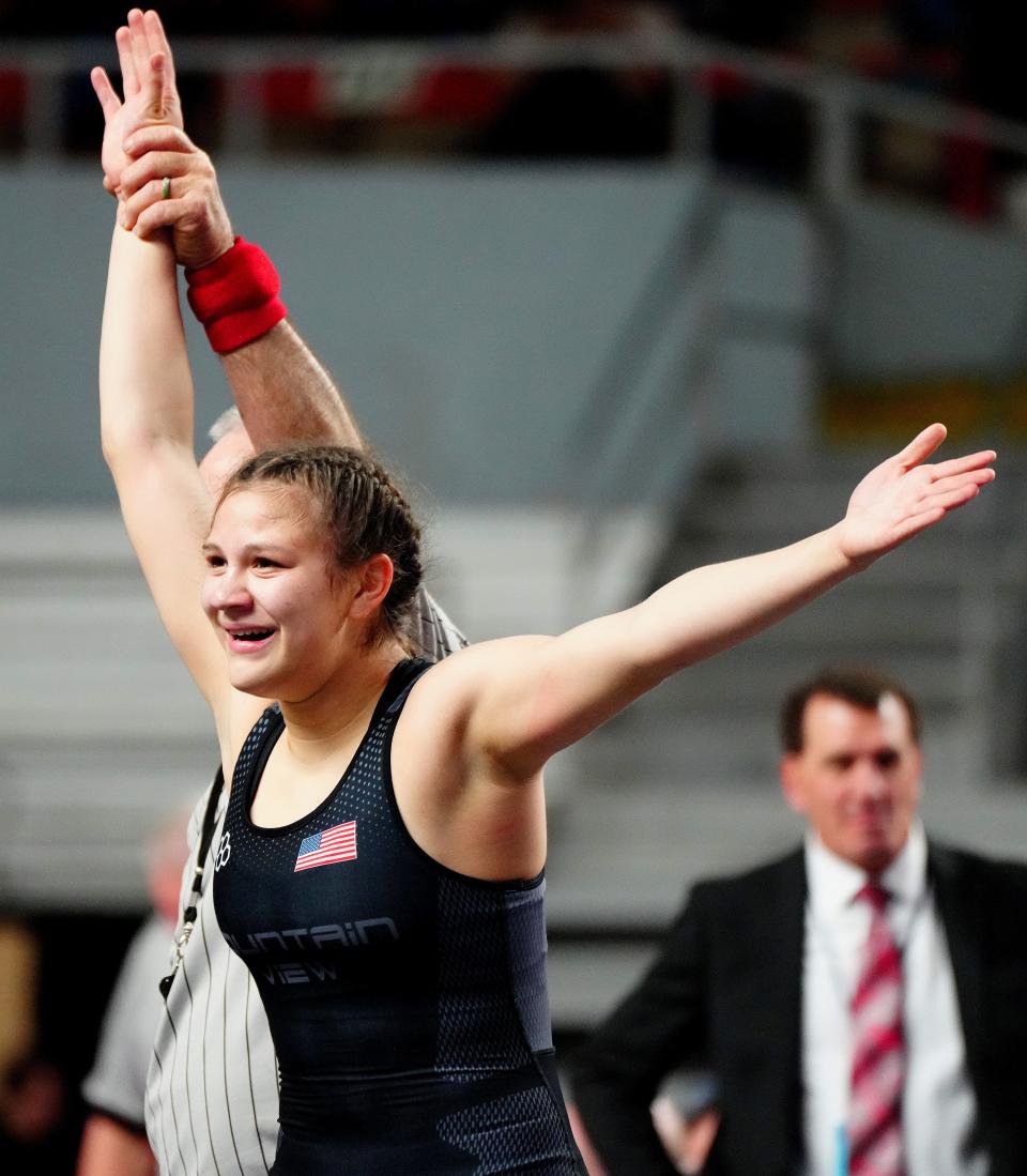 Marana Mountain View wrestler Lillian Gradillas-Flores celebrates beating Liberty wrestler Claire Avery in the 152lbs State Championship match on Feb. 18, 2023, during the State High School Wrestling Championships at Veterans Memorial Coliseum.