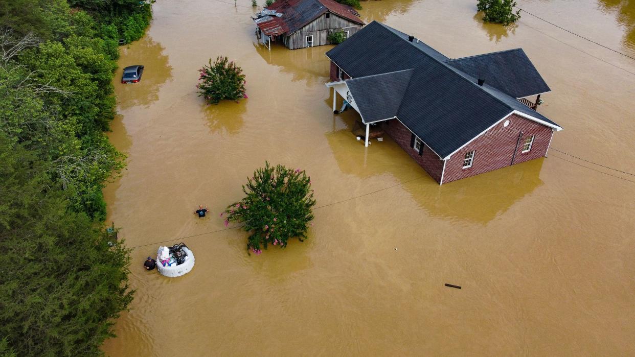 An aerial view of homes submerged under floodwaters from the North Fork of the Kentucky River in Jackson, Ky., on Thursday. 