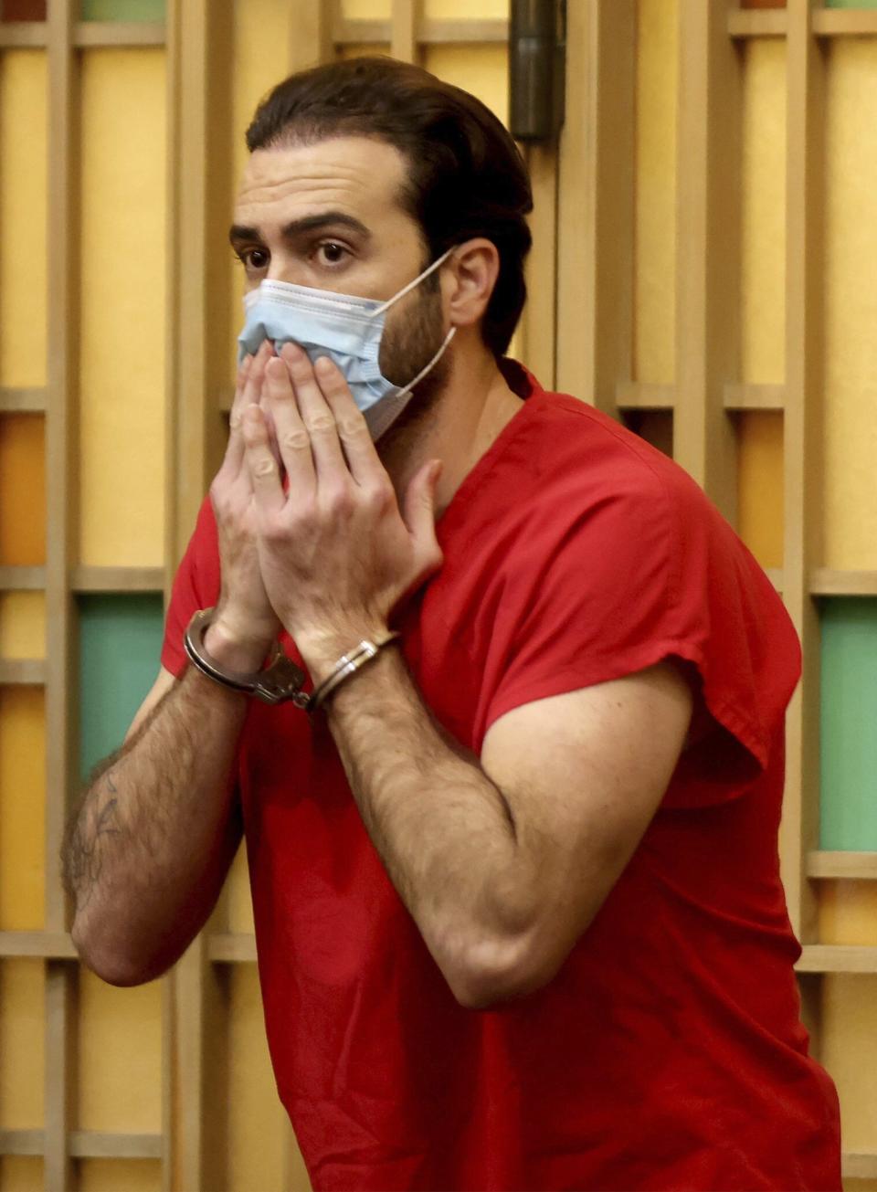 Mexican actor Pablo Lyle blows a kiss toward family members as he leaves the courtroom after Judge Maria Tinkler Mendez ruled against a new trial for Lyle as he, his family, lawyers, and members of the media gathered in Courtroom 4-6 at the Richard E. Gerstein Justice Building in Miami, Fla. on Monday, Dec. 12, 2022. (Carl Juste/Miami Herald via AP)