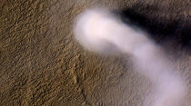 A Martian dust devil roughly 12 miles (20 kilometers) high was captured winding its way along the Amazonis Planitia region of northern Mars on March 14, 2012 by NASA's Mars Reconnaissance Orbiter. (NASA/JPL-Caltech/UA)