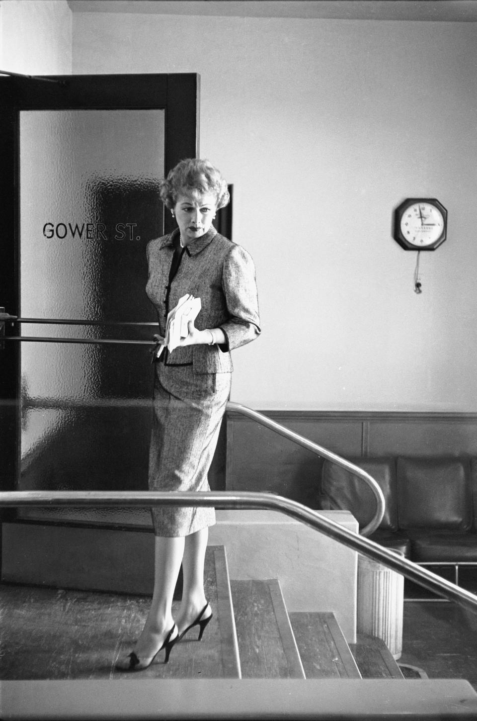 The Desilu Productions co-founder standing by office door to Desilu Studios in Hollywood.