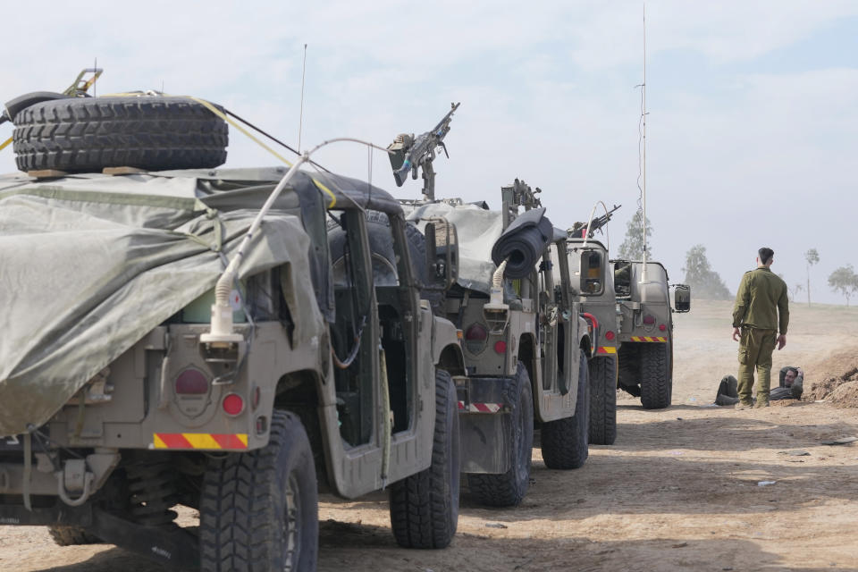 Israeli soldiers gather near the border with the Gaza Strip, southern Israel, Friday, Dec. 8, 2023. (AP Photo/Maya Alleruzzo)