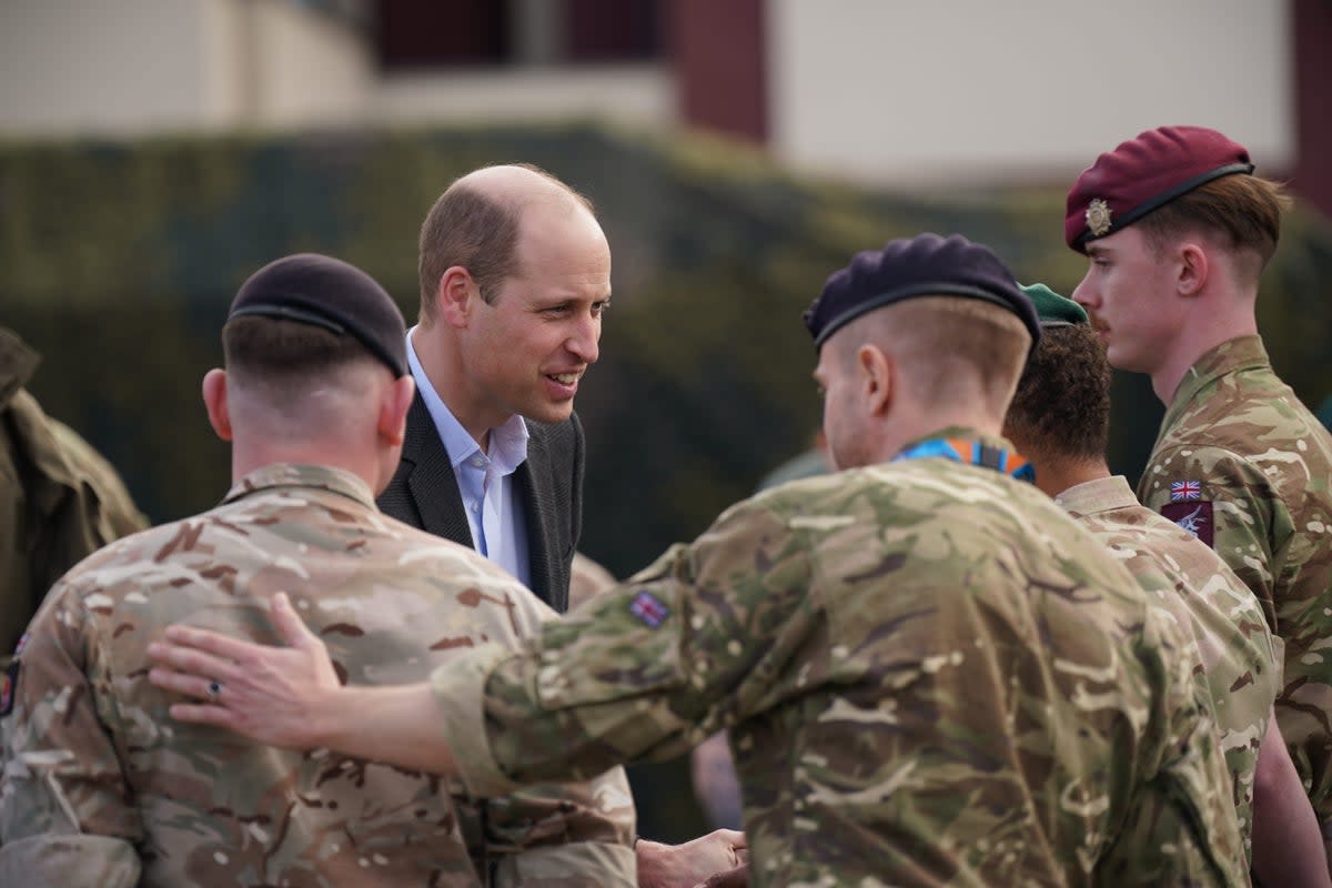 The Prince of Wales meeting members of the British military in Poland (Yui Mok/PA)