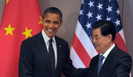 US President Barack Obama and his Chinese counterpart Hu Jintao arrive for a bilateral meeting on the sidelines of the 2012 Seoul Nuclear Security Summit