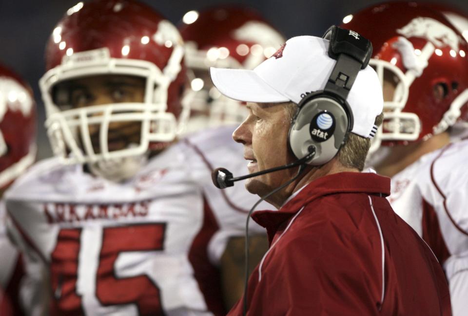 Arkansas coach Bobby Petrino talks with his team during a time-out in the first half against Kentucky at Commonwealth Stadium Oct. 18, 2008 in Lexington, Ky.  