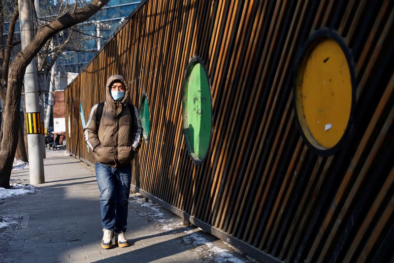 Person walks on a street in Beijing's CBD on a cold winter day in Beijing
