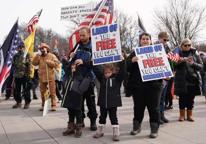 Demonstrators participate in a Defeat the Mandates march in Washington, DC, on Jan. 23, 2022.
