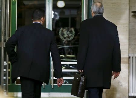 Syrian Ambassador to the U.N. Bashar al Jaafari (R) leaves after the first day of the Syrian peace talks at the United Nations European headquarters in Geneva, Switzerland, January 29, 2016. REUTERS/Denis Balibouse