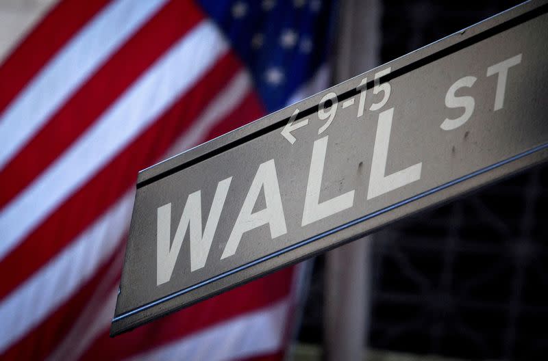 FILE PHOTO: A Wall Street sign outside the New York Stock Exchange