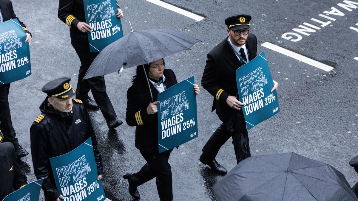 Aer Lingus pilots march around Dublin Airport at the start of the eight-hour strike