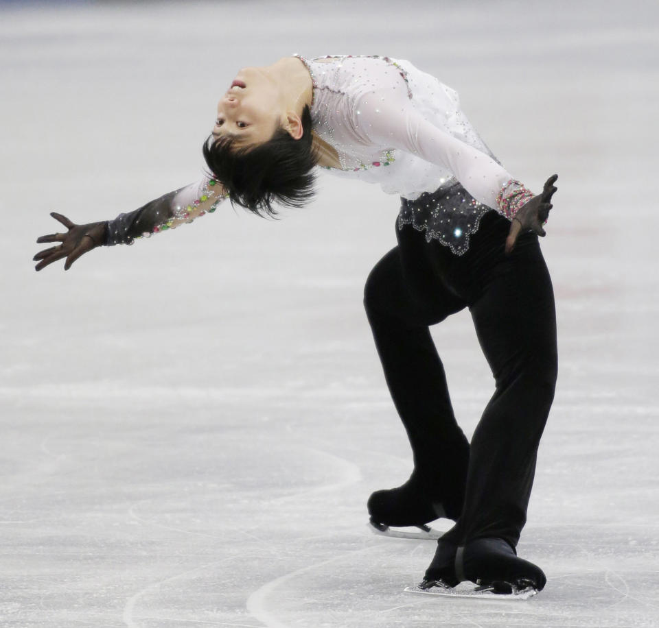 This picture taken on December 22, 2013 shows Japanese figure skater Yuzuru Hanyu performing during the men's single figure skating at Japan's national championships in Saitama, suburban Tokyo. (JIJI PRESS/AFP/Getty Images)