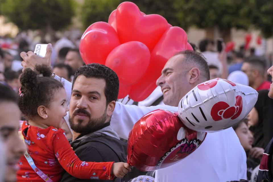 Egyptian Muslims celebrate Eid al-Fitr marking the end of the Muslim holy fasting month of Ramadan outside al-Seddik mosque in Cairo, Egypt, Friday, April 21, 2023. (AP Photo/Amr Nabil)