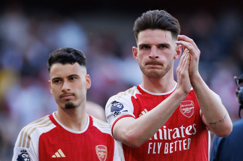 Declan Rice and Gabriel Martinelli of Arsenal look dejected after the Premier League match between Arsenal FC and Everton FC at Emirates Stadium on May 19, 2024 in London, England