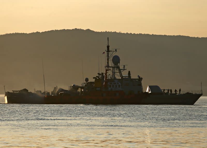 An Indonesian Navy's ship is seen at the Tanjung Wangi port as the search continues for the missing KRI Nanggala-402 submarine