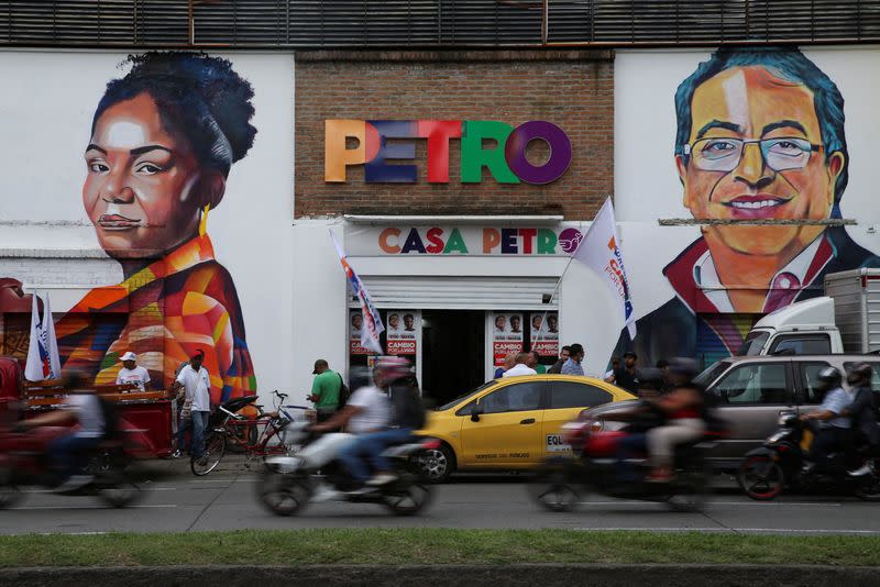 A wall with an image of Colombian left-wing vice-presidential candidate Francia Marquez and Colombian left-wing presidential candidate Gustavo Petro is pictured one day before the first round of the presidential election, in Cali