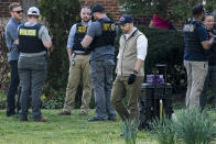 Authorities investigate a home possibly connected to the school shooting in Nashville, Monday, March 27, 2023, in Nashville, Tenn. Nashville police identified the victims in the private Christian school shooting Monday as three 9-year-old students and three adults in their 60s, including the head of the school. (AP Photo/John Bazemore)