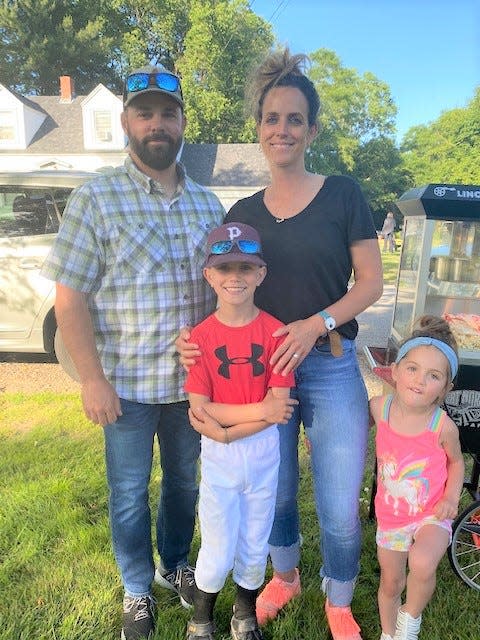 Greenland Citizen of the Year Jenna Raizes with her husband Charlie and children Ryder, 8, and Emilie, 4.