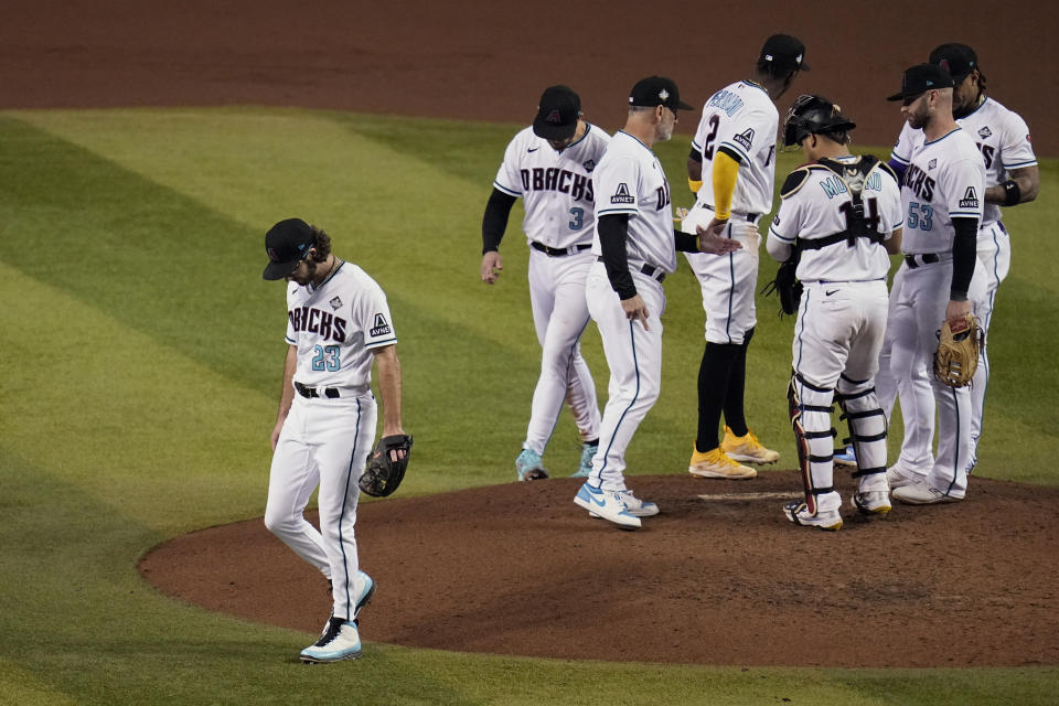 Arizona Diamondbacks starting pitcher Zac Gallen (23) leaves the mound after being pulled during the seventh inning in Game 5 of the baseball World Series against the Texas Rangers Wednesday, Nov. 1, 2023, in Phoenix. (AP Photo/Gregory Bull)