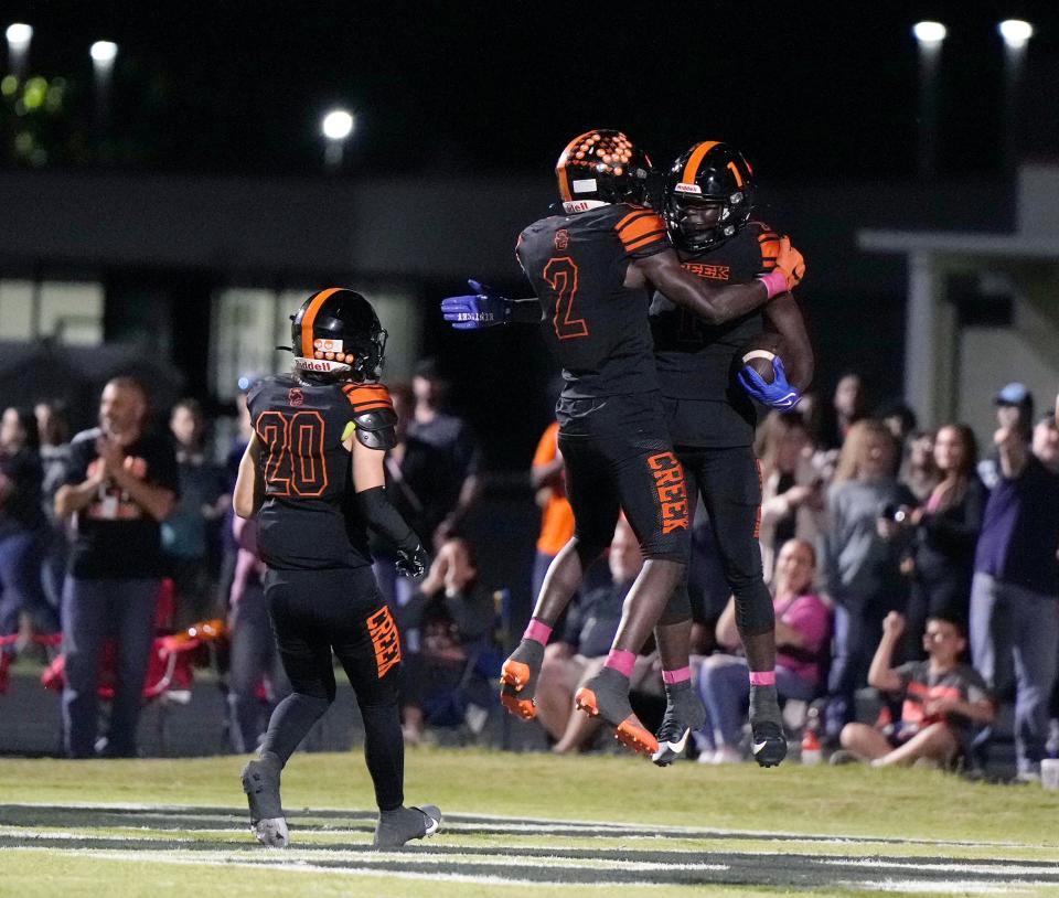 Spruce Creek celebrates a score during a game with New Smyrna Beach at Spruce Creek High School in Port Orange, Friday, Oct. 20, 2023.