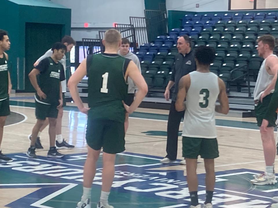 Mercyhurst University men's basketball coach Gary Manchel huddles the Lakers during last Friday's practice at the Mercyhurst Athletic Center. The Lakers worked out two days after they beat Indiana University of Pennsylvania 93-85 in double overtime for Manchel's 500th career coaching victory. He formerly coached at the University of Massachusetts-Lowell.