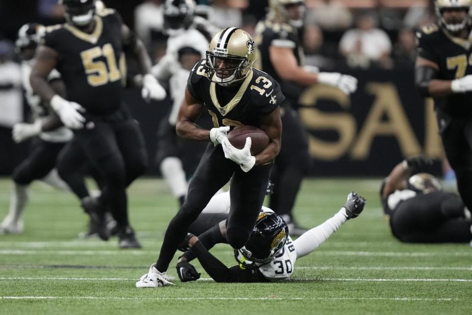 New Orleans Saints wide receiver Michael Thomas carries.