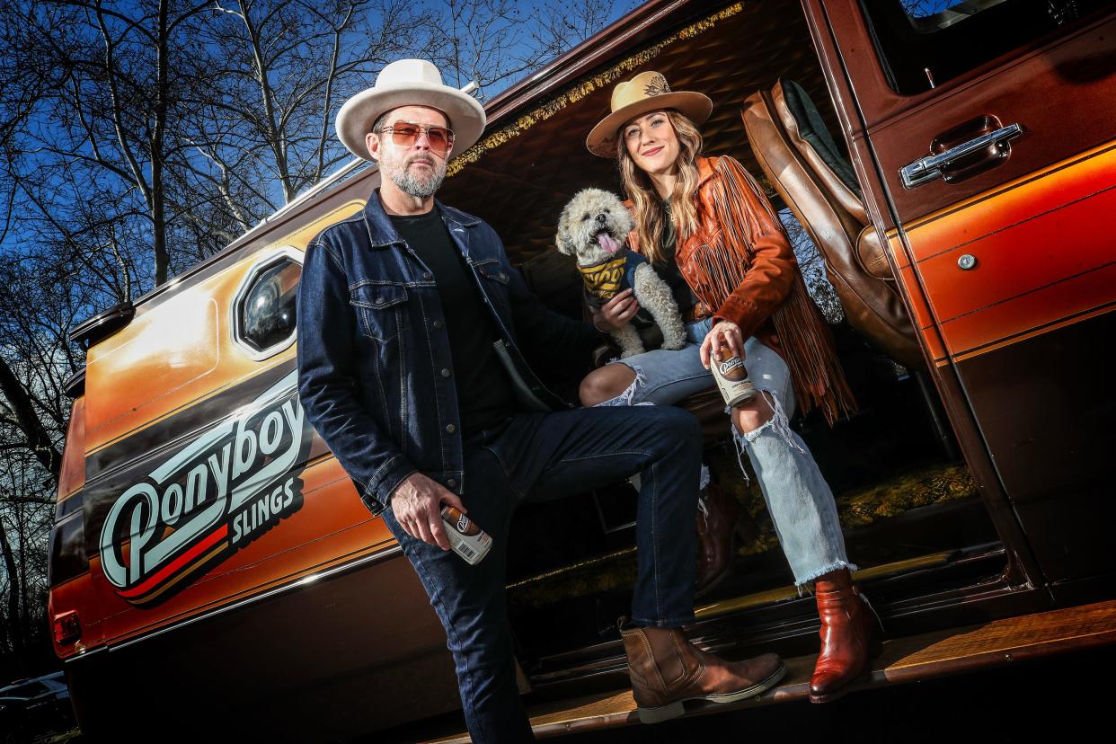 Ponyboy Slings is Louisville-based bourbon cocktail in a can company launched in 2023 by husband-and-wife team Mike and Janell Bass. They've created a 1970s-themed brand, complete with a 1977 van used for events. Their dog is Whiskey. March 4, 2024