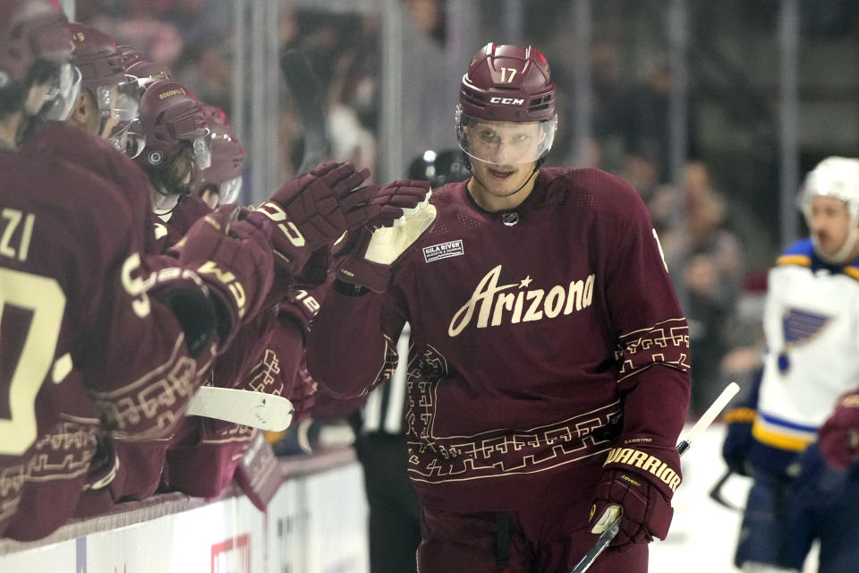 Arizona Coyotes center Nick Bjugstad is congratulated for his goal against the St. Louis Blues during the first period during an NHL hockey game Wednesday, Nov. 22, 2023, in Tempe, Ariz. (AP Photo/Rick Scuteri)