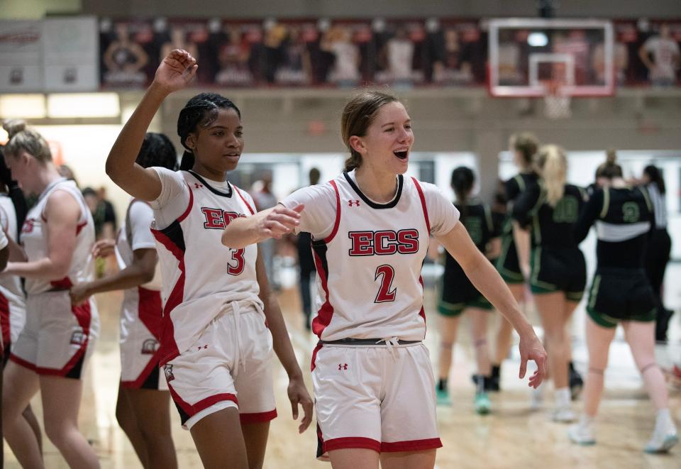 Maddie O'Berski and Areille Marc of ECS celebrate their win over St. John Neumann in the Region 2A-3 girls basketball final on Thursday, Feb. 22, 2024, in Fort Myers.