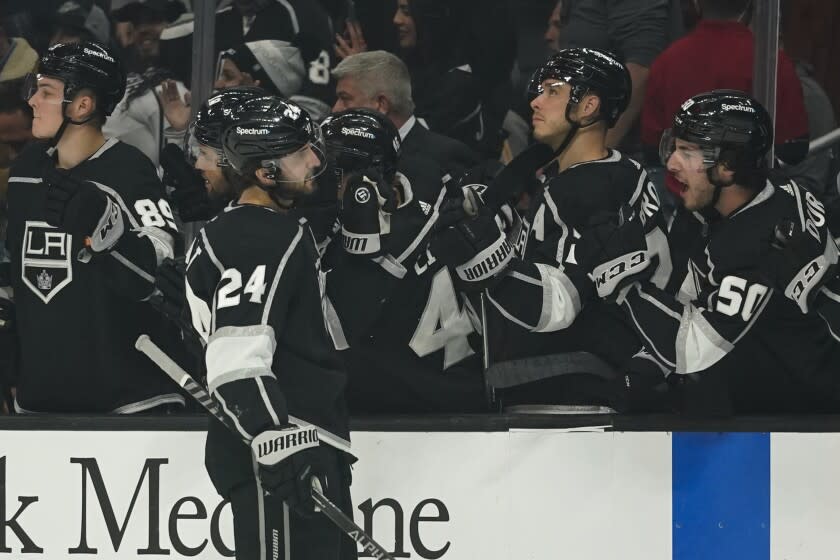 Los Angeles Kings center Phillip Danault (24) celebrates with teammates after scoring a goal during the first period of an NHL hockey game against the Columbus Blue Jackets Saturday, April 16, 2022, in Los Angeles.  (AP Photo / Ashley Landis)