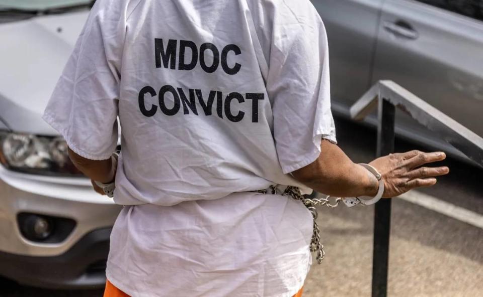 A woman going through the civil commitment process, wearing a shirt labeling her a “convict,” is transported from her commitment hearing back to a county jail to await transportation to a state hospital in north Mississippi last spring.