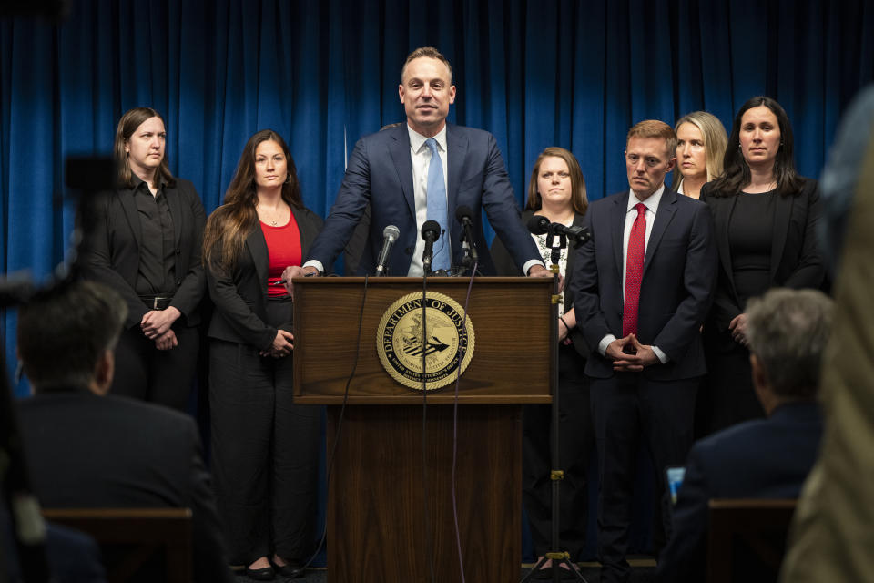 Assistant U.S. Attorney Joe Thompson, surrounded by the prosecution's trial team, speaks during a news conference after the verdict was read in the first Feeding Our Future case at the federal courthouse in Minneapolis, Friday, June 7, 2024. A jury convicted five Minnesota residents and acquitted two others Friday for their roles in a scheme to steal more than $40 million that was supposed to feed children during the coronavirus pandemic. (Leila Navadi/Star Tribune via AP)