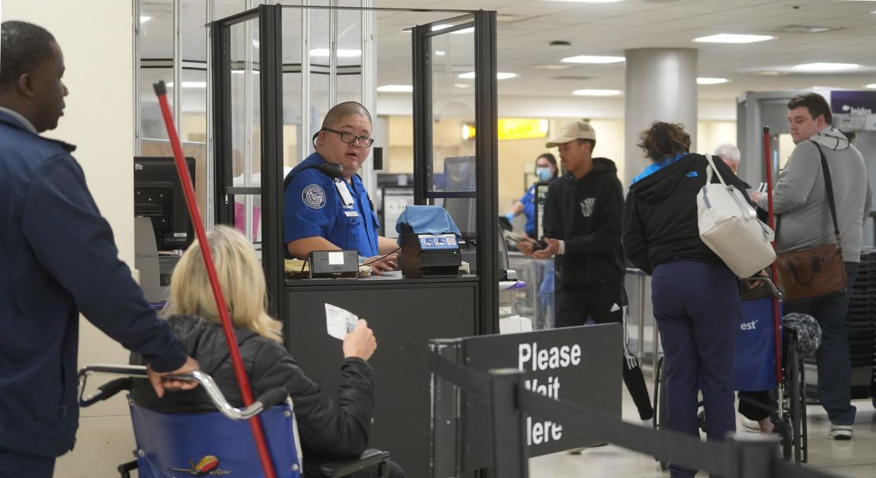 Transportation Security Administration officers give instructions to travelers on Tuesday, Jan. 9, 2024 at John Glenn Columbus International Airport.