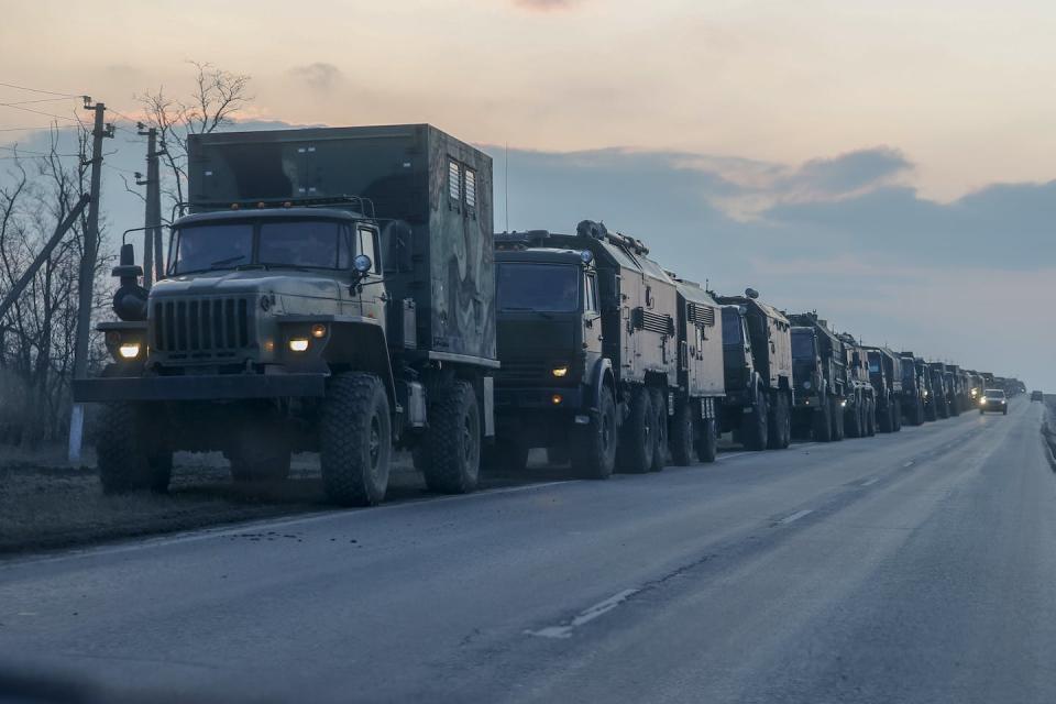 A convoy of Russian military vehicles moves toward the Donbas region of eastern Ukraine on Feb. 23, 2022. <a href="https://www.gettyimages.com/detail/news-photo/convoy-of-russian-military-vehicles-is-seen-as-the-vehicles-news-photo/1238710804?adppopup=true" rel="nofollow noopener" target="_blank" data-ylk="slk:Stringer/Anadolu Agency via Getty Images;elm:context_link;itc:0;sec:content-canvas" class="link ">Stringer/Anadolu Agency via Getty Images</a>