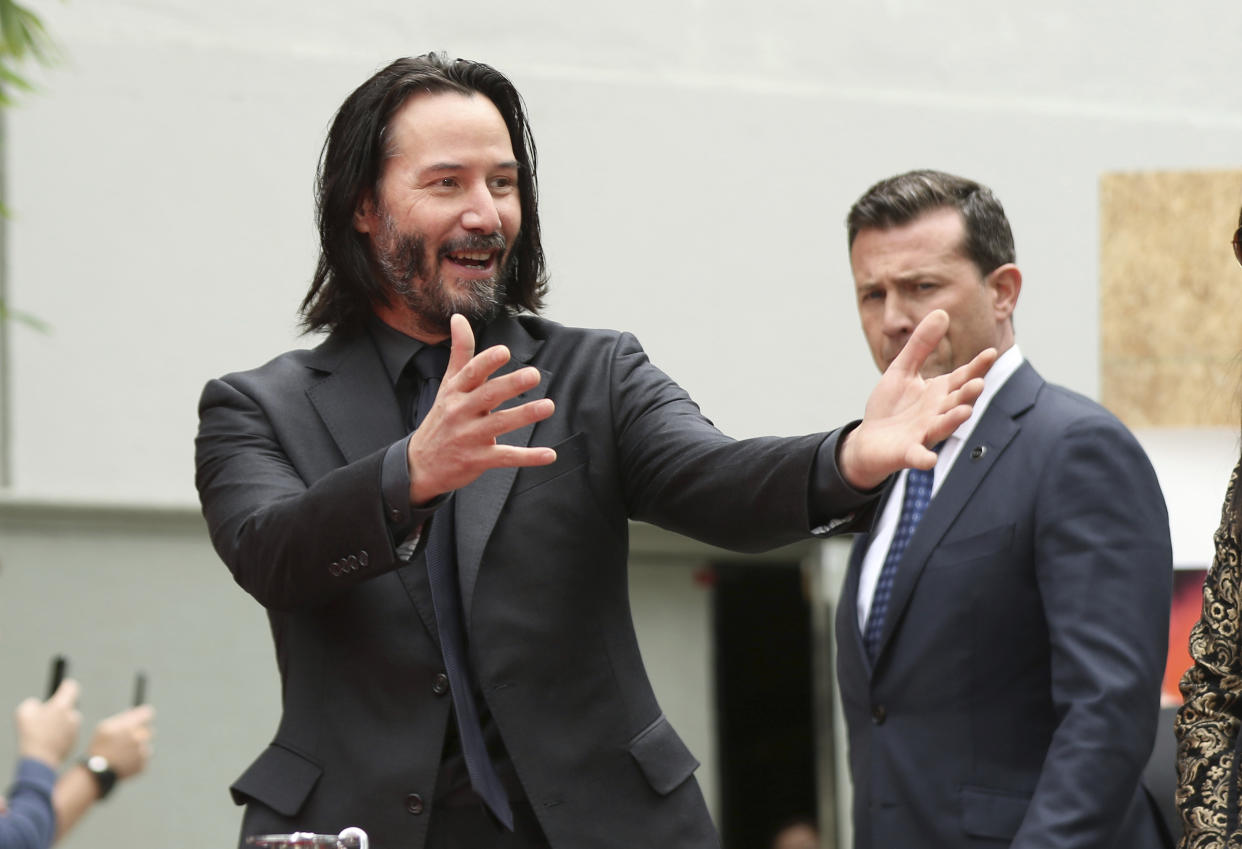 Keanu Reeves arrives at a hand and footprint ceremony honoring him at the TCL Chinese Theatre on Tuesday, May 14, 2019 at in Los Angeles. (Photo by Willy Sanjuan/Invision/AP)