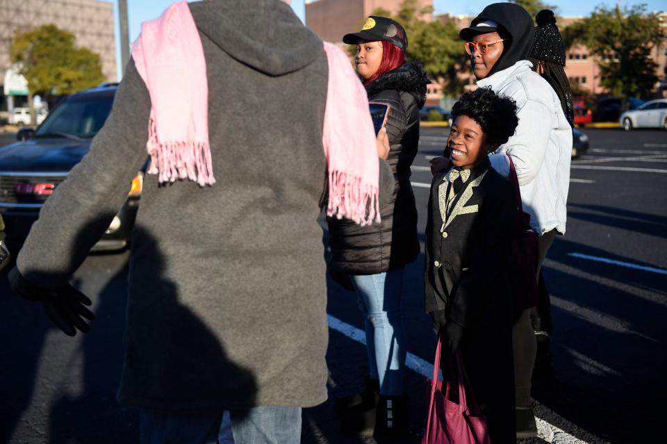 FILE - Tony Gray, 7, wears a James Brown costume at the James Brown Turkey Giveaway outside of James Brown Arena on Monday, Nov. 21, 2022. The giveaway returns Nov. 20.