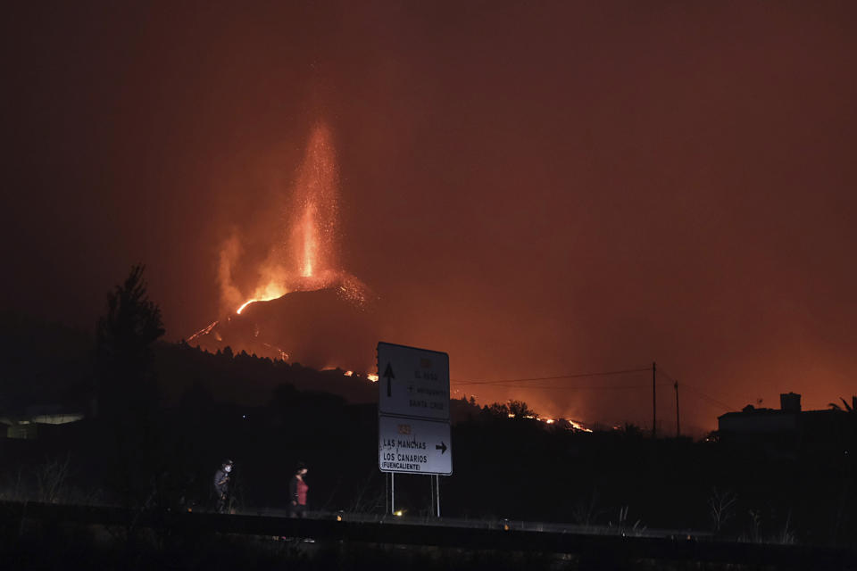 A volcano continues to erupt on the Canary island of La Palma, Spain on Saturday Oct. 16, 2021. Officials say there is no sign that a volcanic eruption on the Spanish island of La Palma is coming to an end, one month after it began. The volcano on one of the Canary Islands off northwest Africa has so far destroyed more than 1,800 buildings, mostly homes. (AP Photo/Daniel Roca)