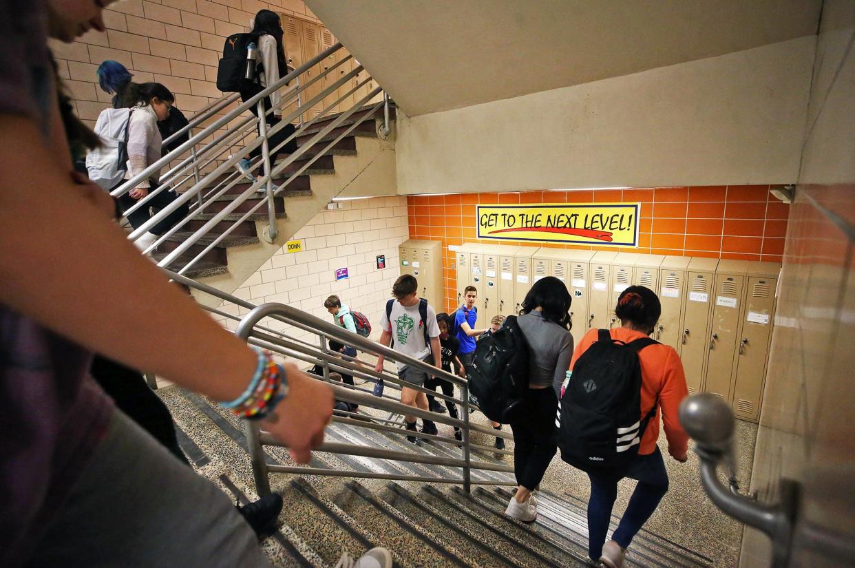 Students scurry up and down the stairway between classes at Nordonia Middle School.