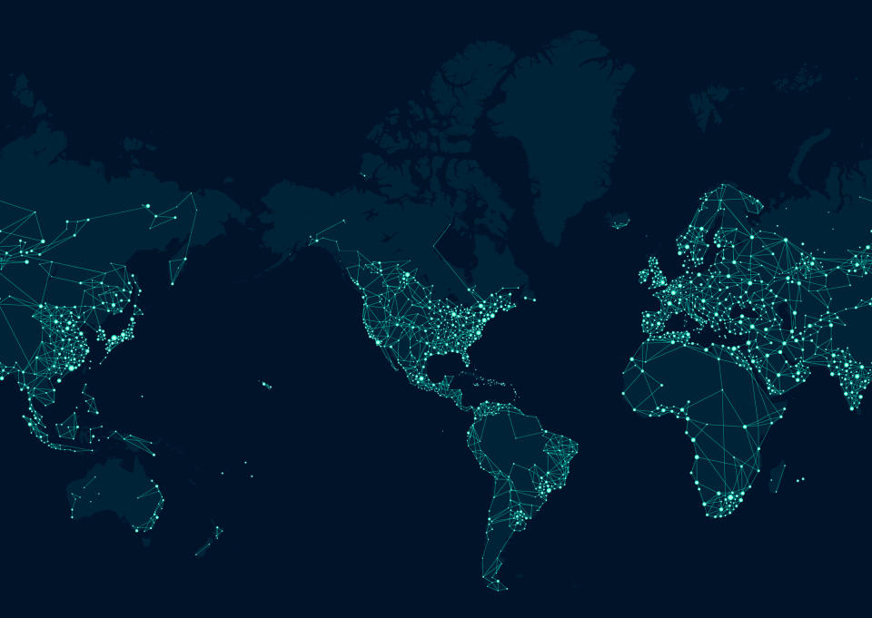 A map of the globe lit up by lights around major cities as if seen from space at night.