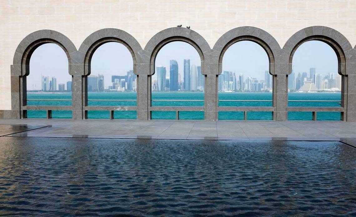 Doha’s skyline is seen through the Moorish arches of the Museum of Islamic Art.