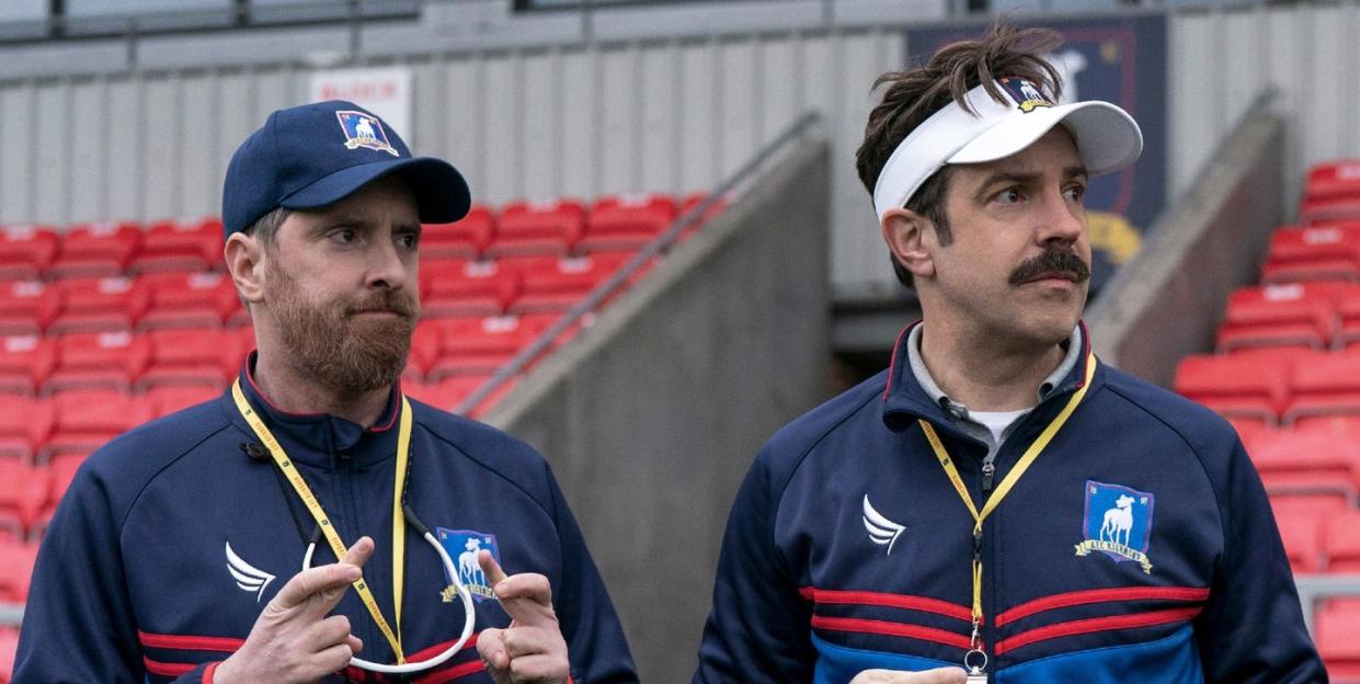 ted lasso season 2 brendan hunt as coach beard, jason sudeikis as ted lasso and nate mohammed as coach nate