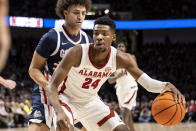 Alabama forward Brandon Miller (24) works against Gonzaga forward Anton Watson (22) during the first half of an NCAA college basketball game, Saturday, Dec. 17, 2022, in Birmingham, Ala. (AP Photo/Vasha Hunt)