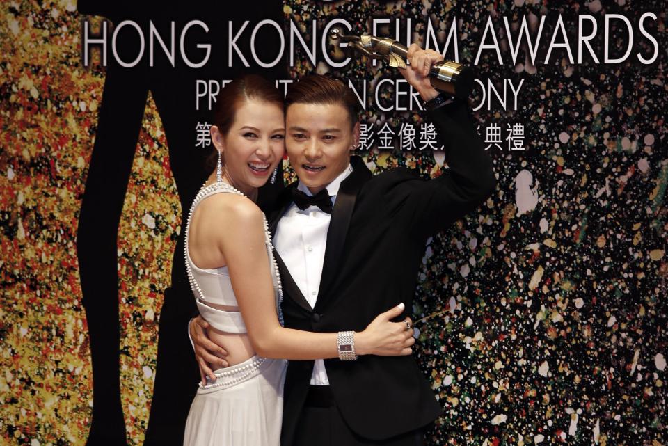 Chinese actor Zhang and wife pose at the 33rd Hong Kong Film Awards in Hong Kong