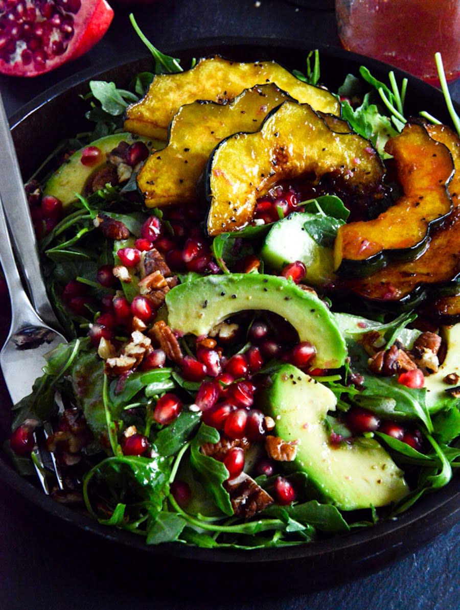 Autumn Arugula Salad With Caramelized Squash and Pomegranate Ginger Vinaigrette from How Sweet It Is