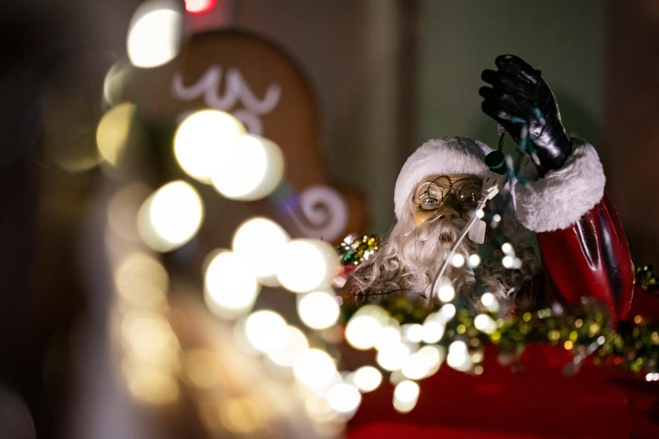 A Santa statue handles reins of a horse as part of the decorations at the home of Ron Spering in Marco Island on Wednesday, Dec. 6, 2023.