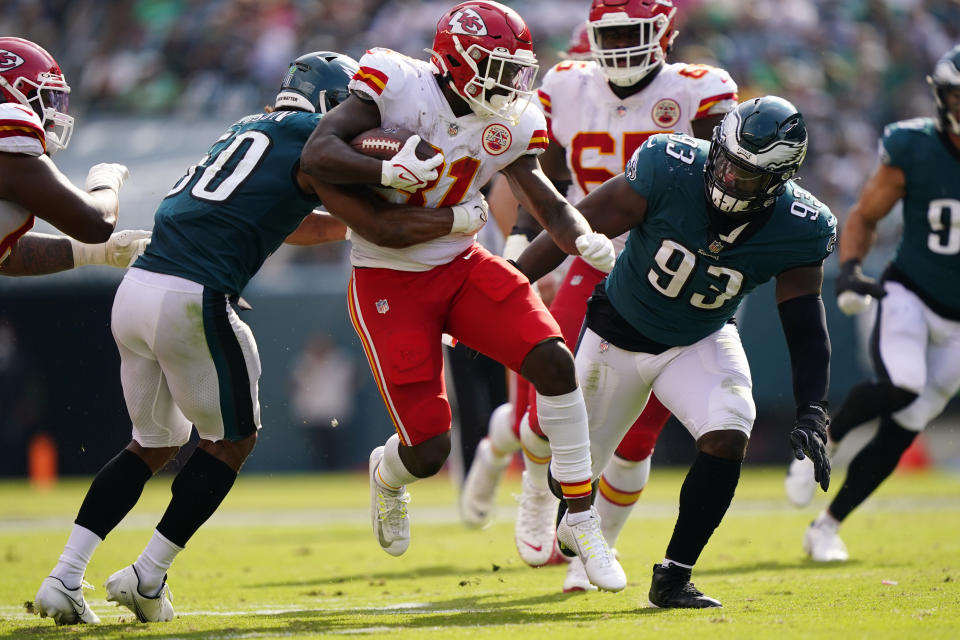 Kansas City Chiefs running back Darrel Williams (31) runs with the ball in front of Philadelphia Eagles defensive tackle Milton Williams (93) and Philadelphia Eagles linebacker Eric Wilson (50) during the second half of an NFL football game Sunday, Oct. 3, 2021, in Philadelphia. (AP Photo/Matt Rourke)