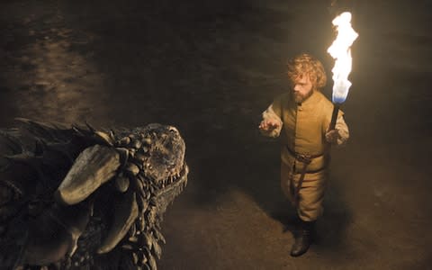 Tyrion Lannister meets an imprisoned dragon in Game of Thrones - Credit: HBO