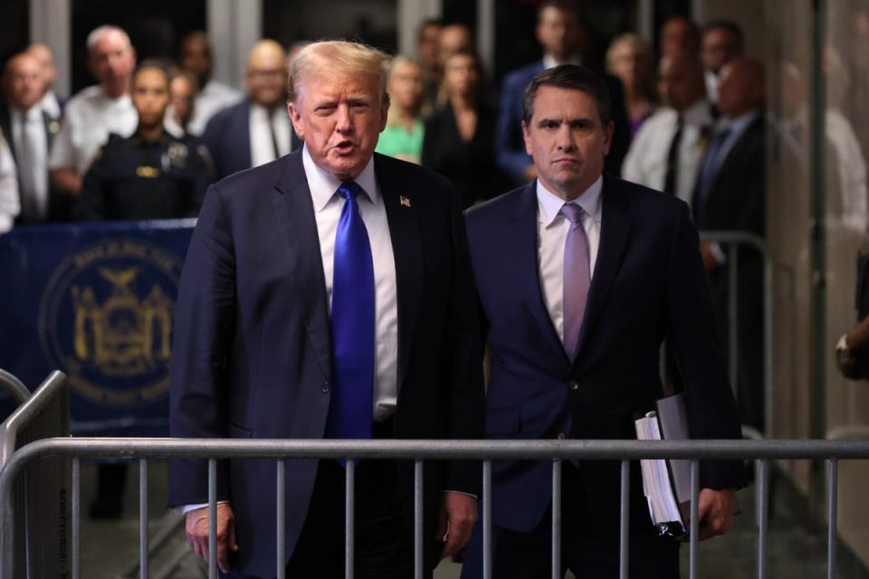 Former US president Donald Trump gives brief remarks alongside his attorney Todd Blanche after the conclusion of his hush money trial at Manhattan Criminal Court on 30 May 2024 (Getty Images)