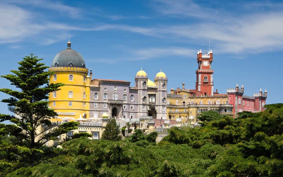 <p>Its no surprise that Hans Christian Andersen was inspired by Sintra, and more specifically Pena Palace, when writing his famed tales. The palace is visible from any place in the park, and its vibrant colors set the perfect scene of 19<sup>th</sup>-centruy romanticism. The palace is surrounding by a lush park, and getting a little bit lost on your way to Pena is highly recommended.</p>