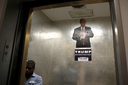 An image of Republican presidential nominee Donald Trump hangs inside a freight elevator at Trump Tower in Manhattan, New York, U.S., October 7, 2016. REUTERS/Mike Segar