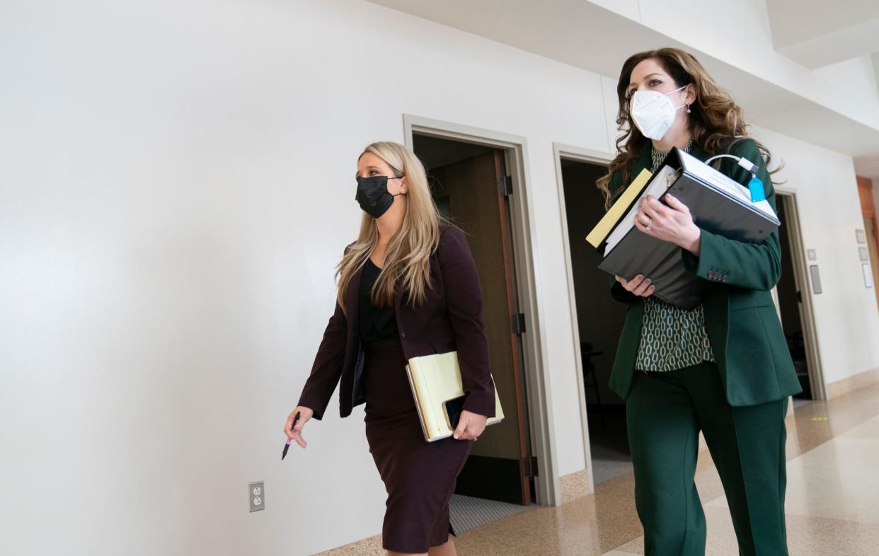 Attorneys Mariell Lehman, left, and Shannon Smith make their way to court to defend James and Jennifer Crumbley, the parents of Ethan Crumbley, who carried out the deadly school shooting at Oxford High School in November 2021. The couple faces involuntary manslaughter charges for allegedly buying the gun that the police say their son used in the shooting.